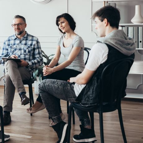 Group meeting with counselor for people trying to gain life balance